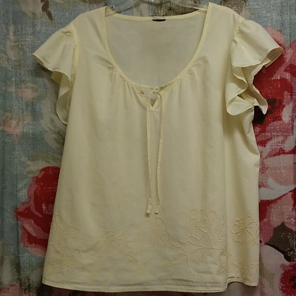 A soft yellow blouse